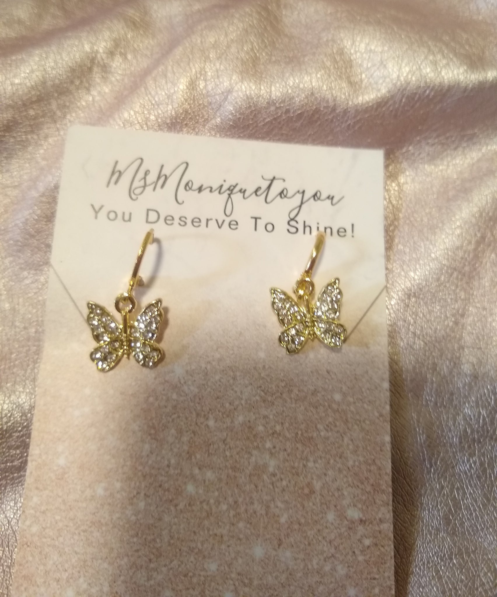 Dainty dangling crystal butterfly earrings in gold tone