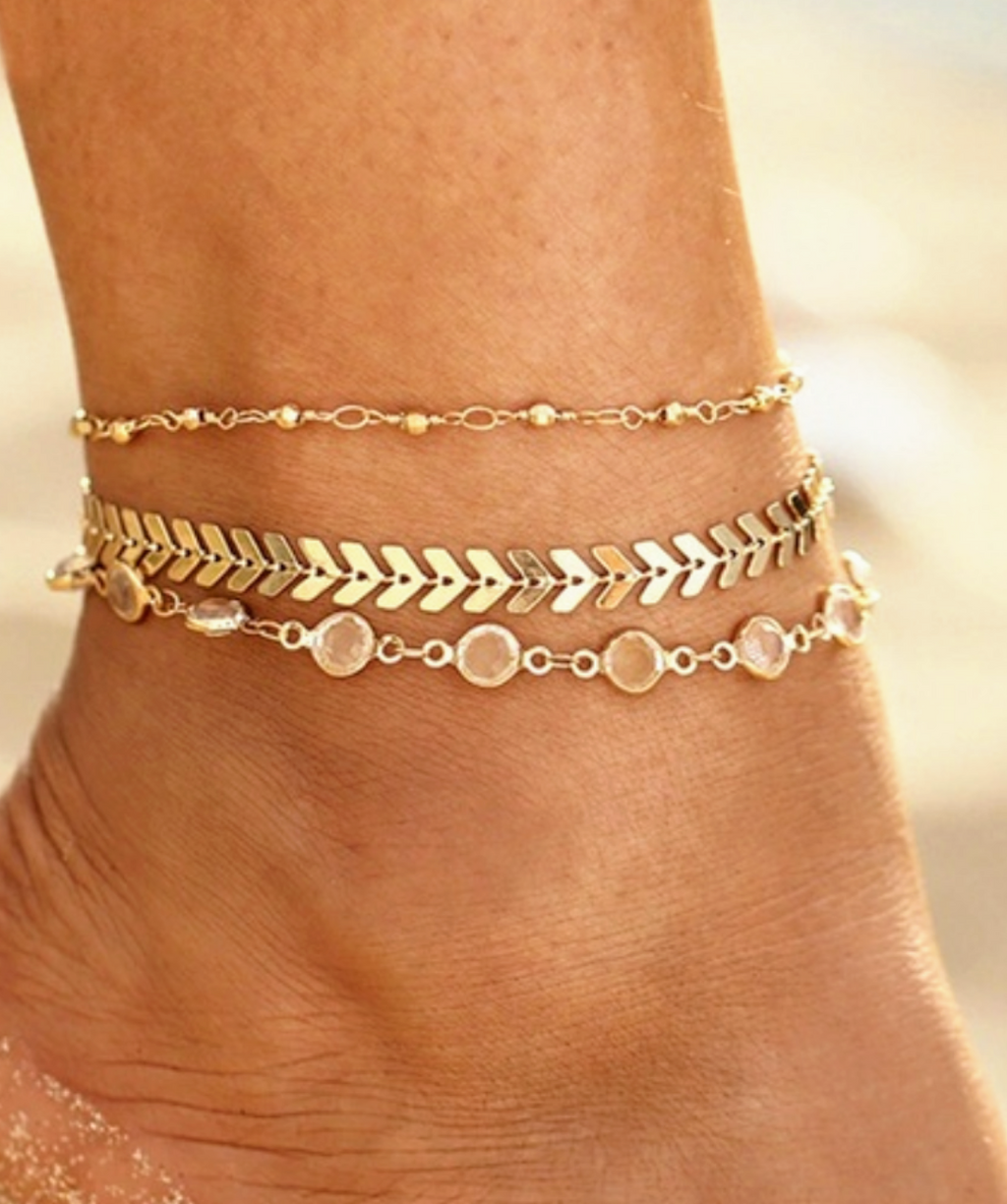 Delicately lovely, 3 piece gold tone crystal ankle bracelet set