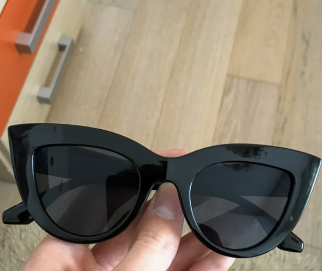 Black, classic cat eye sunglasses, with deep plum tinted lens