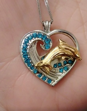 "Dolphin Tales" silver & gold tone necklace with turquoise crystals.