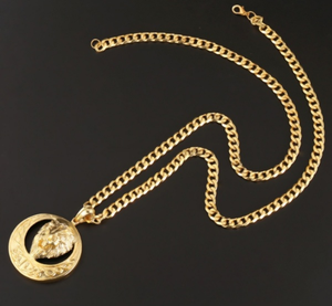 Gold tone Lions head necklace on link chain