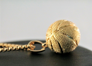 Solid gold tone basketball charm on gold tone chain