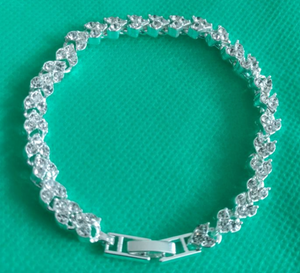 The "I Love You" heart-shaped tennis bracelet.