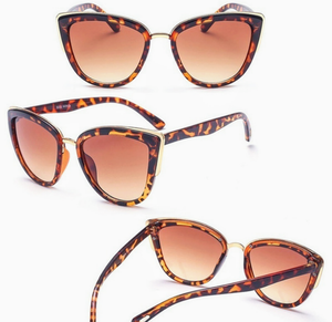 Tortoise oversized cat eye sunglasses. Gold tone accents