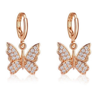 Dainty dangling crystal butterfly earrings in gold tone