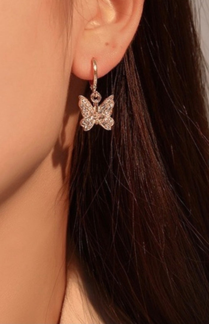 Dainty dangling crystal butterfly earrings in gold tone