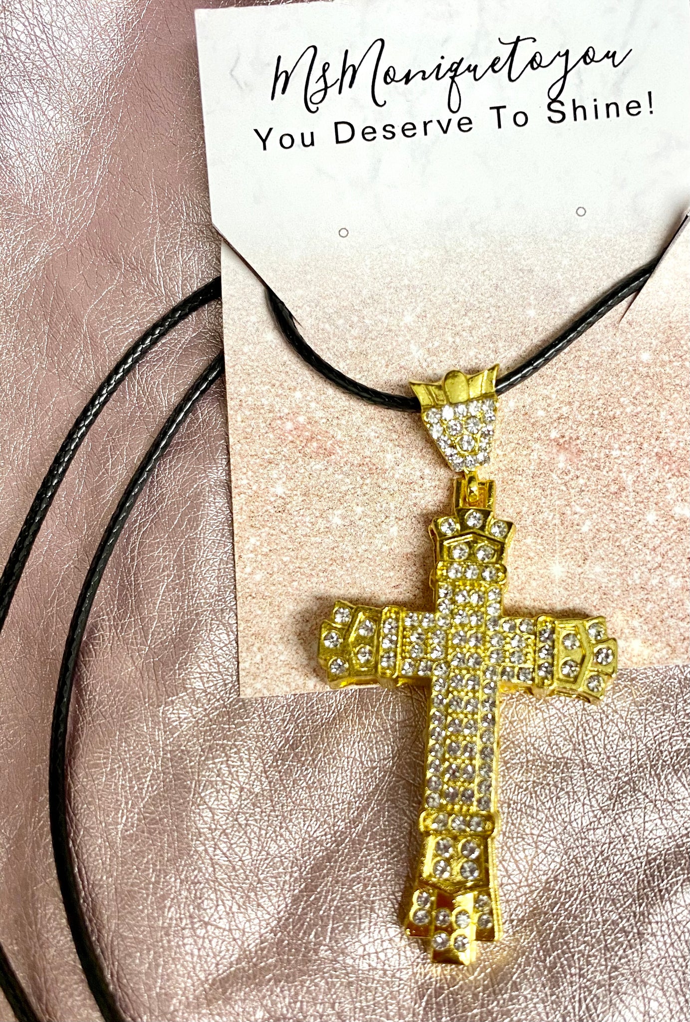 Shine Bright Like A Diamond cross necklace. Gold tone.