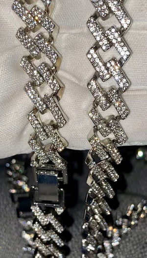 20” Iced Out Cuban Link Chain in silver tone. Brilliant shine and clustered is white Rhinestone.