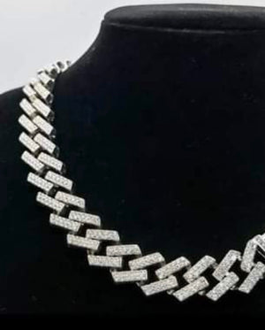 20” Iced Out Cuban Link Chain in silver tone. Brilliant shine and clustered is white Rhinestone.