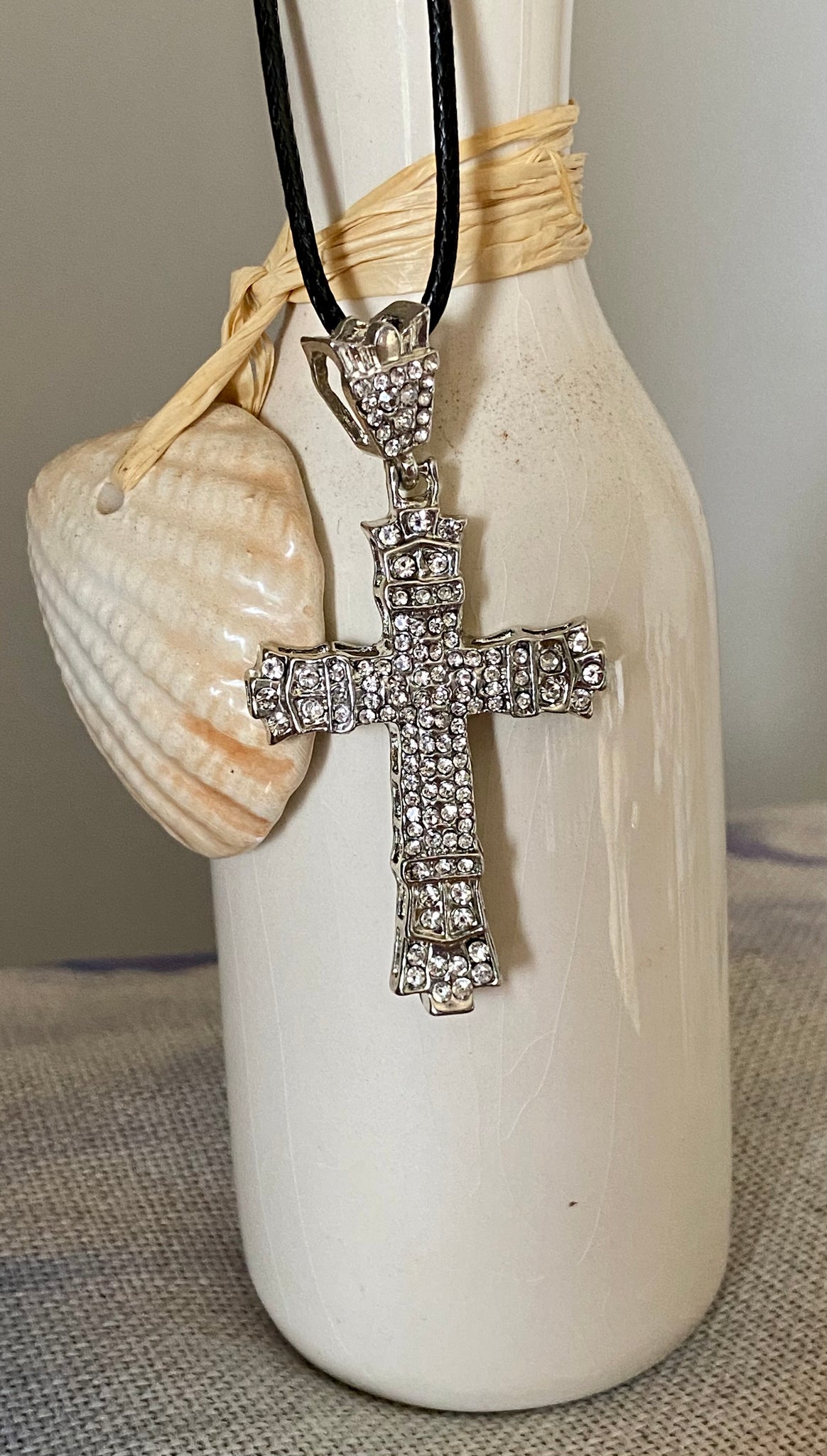 Shine Bright Like A Diamond cross necklace. Silver tone.